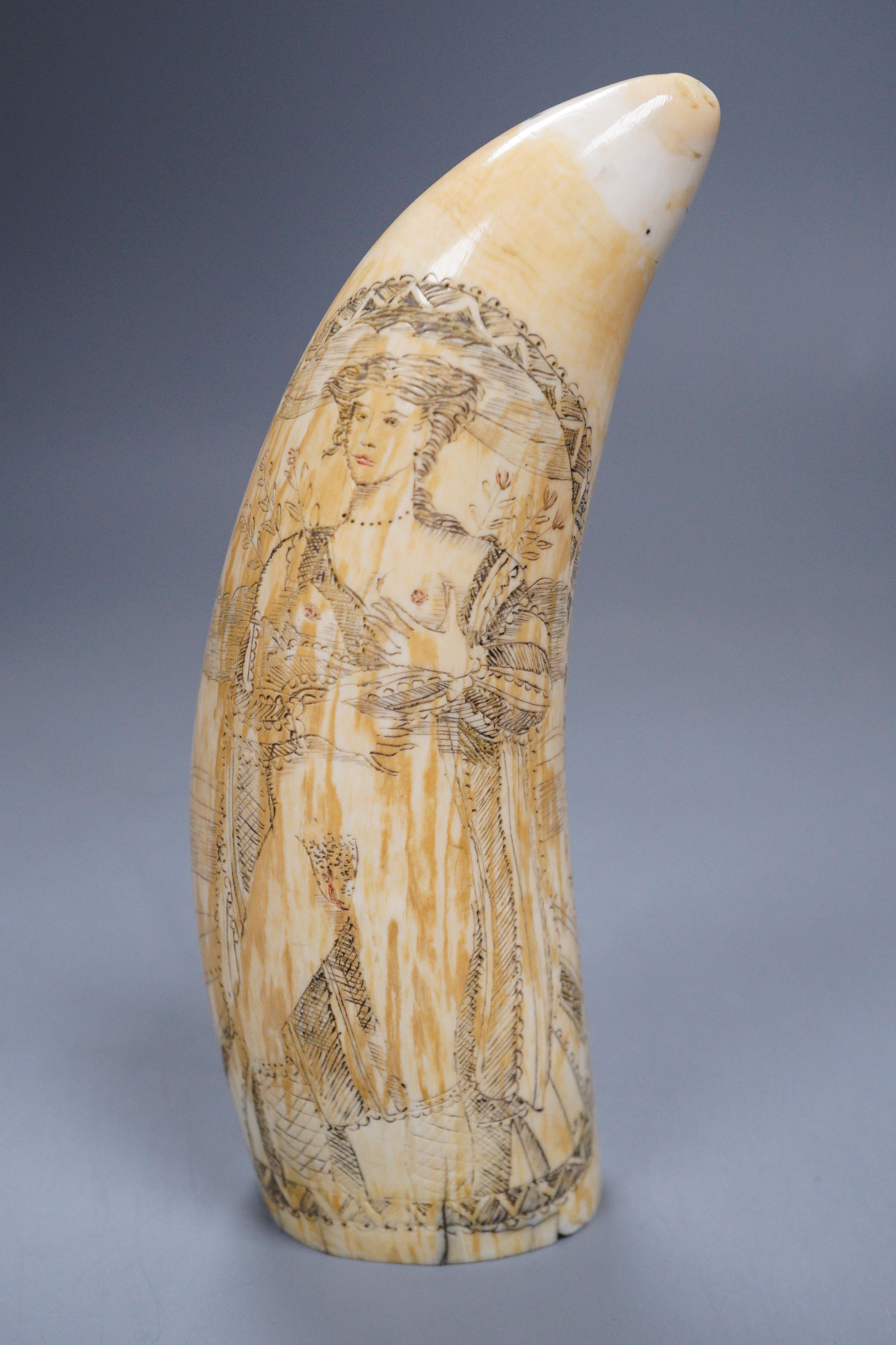 A carved scrimshaw whale tooth titled ‘Ship Dove’, 16cm